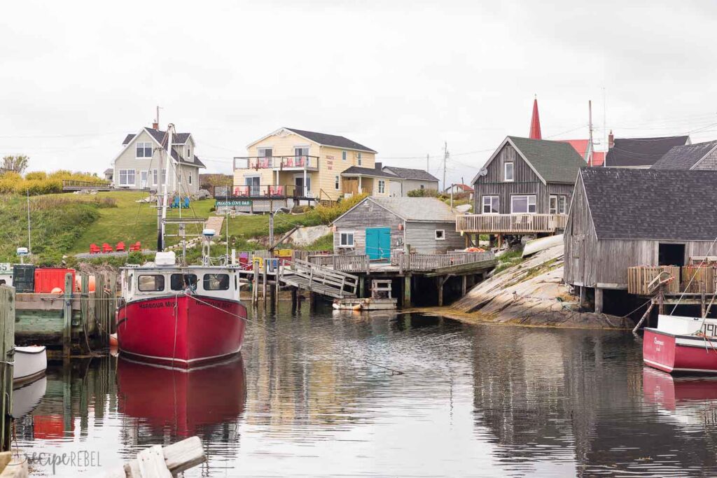 peggy's cove nova scotia with fishing boats and shacks