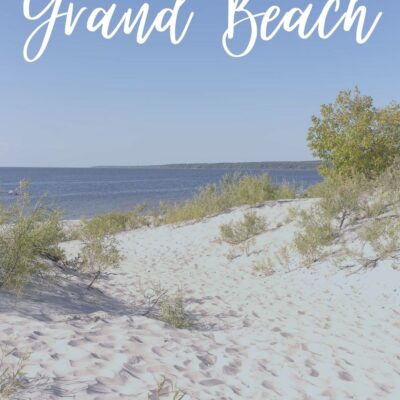grand beach manitoba photo of beach with title in white text