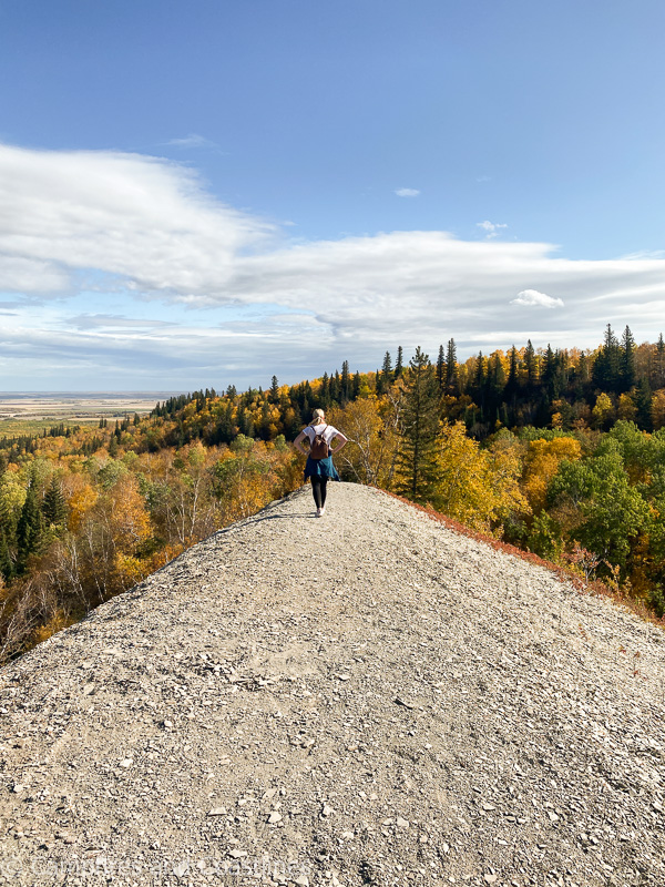 woman standing on top of bald hill clear lake